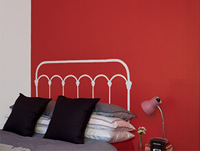 Kids bedroom with a red feature wall